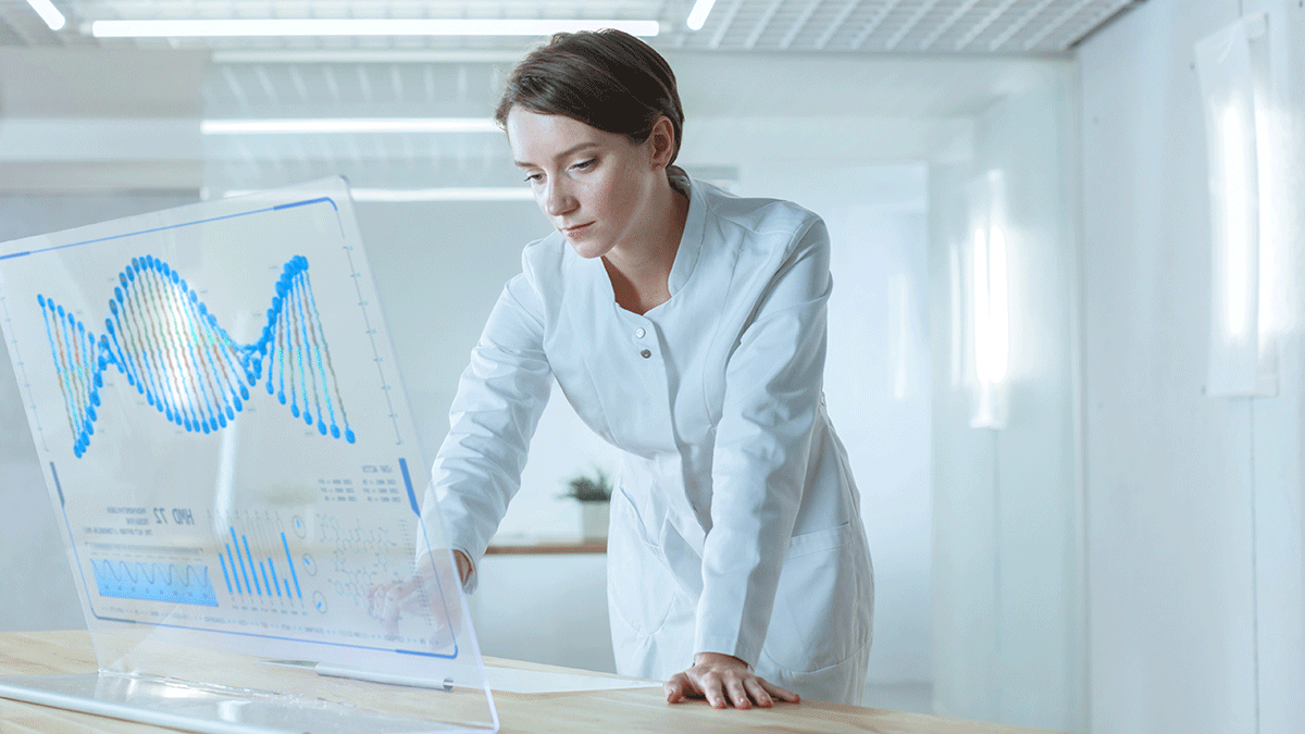 A doctor looks at a transparent screen with a schematic image of a DNA