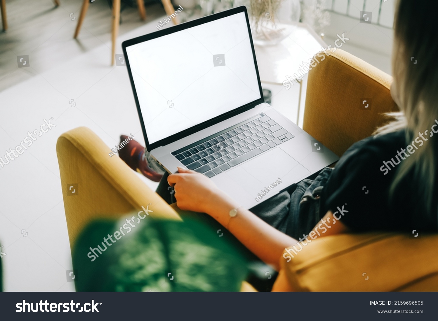 stock-photo-young-caucasian-woman-sitting-on-sofa-at-home-and-using-laptop-computer-with-white-blank-screen-2159696505 stock-photo-young-caucasian-woman-sitting-on-sofa-at-home-and-using-laptop-computer-with-white-blank-screen-2159696505