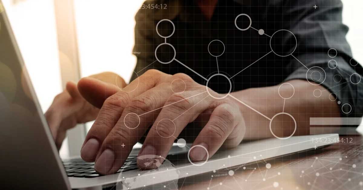 Close-up of hands typing on a laptop keyboard. Overlaid graphics show network connections and circles symbolizing digital data. Close-up of hands typing on a laptop keyboard. Overlaid graphics show network connections and circles symbolizing digital data.