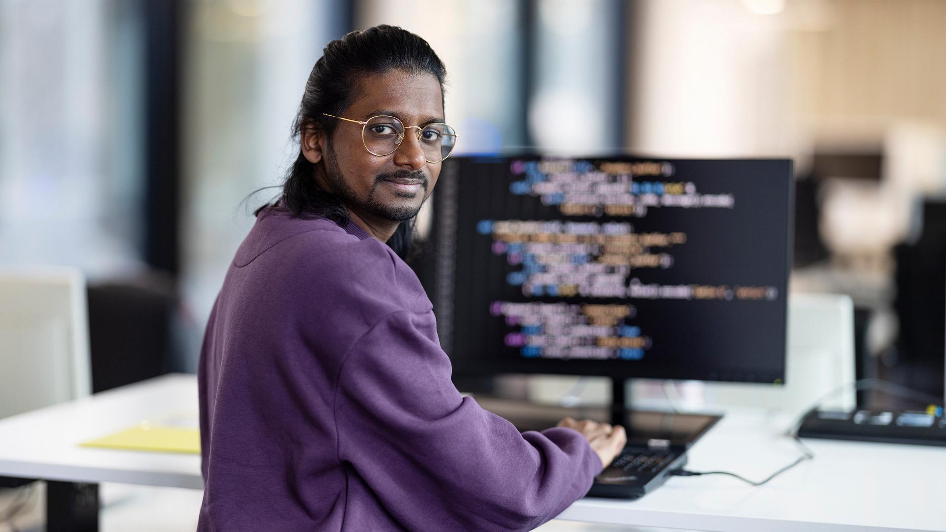 Man in front of a screen Man in front of a screen